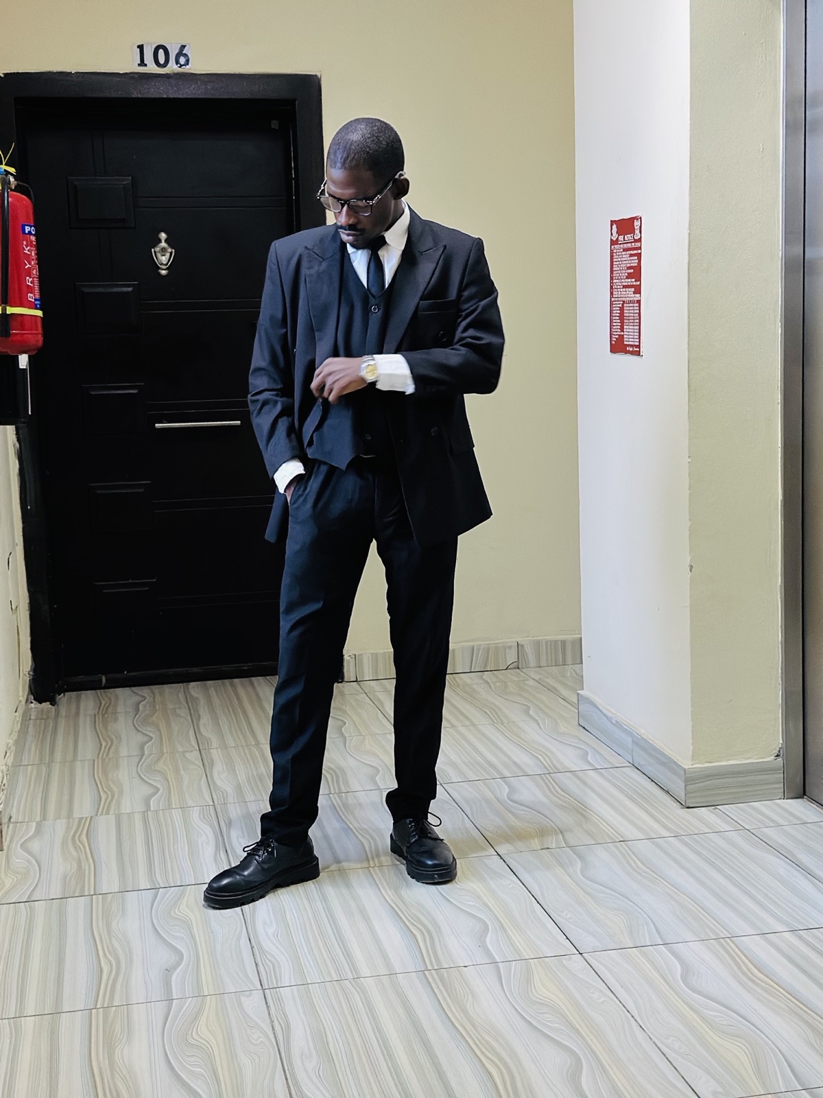 Oluwafemi Akinbi in a navy suit